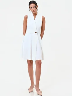 ABITO BIANCO CON REVERS E BOTTONE DESIGN