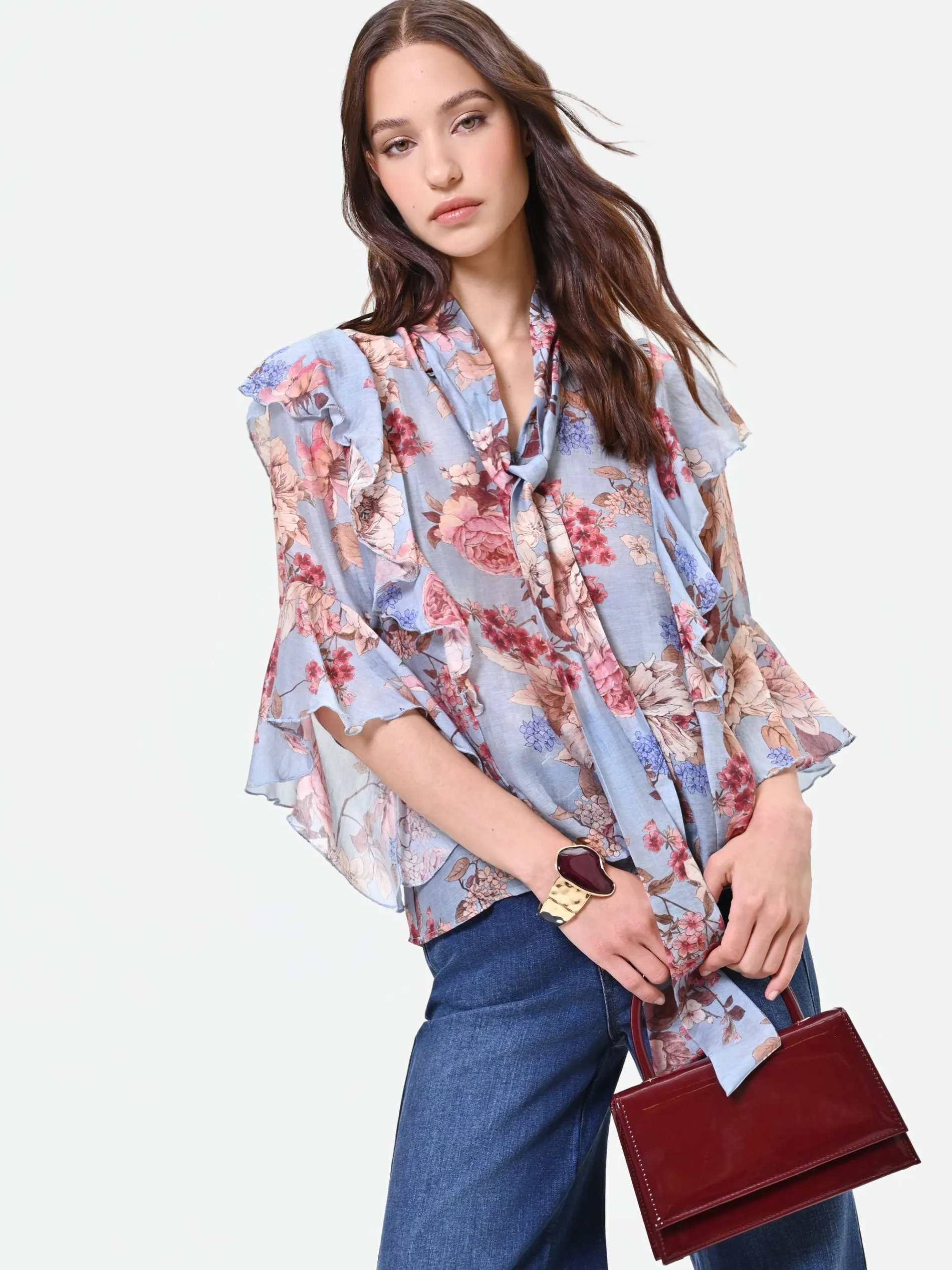 BLUSA AZZURRA CON FANTASIA FLOREALE E FIOCCO