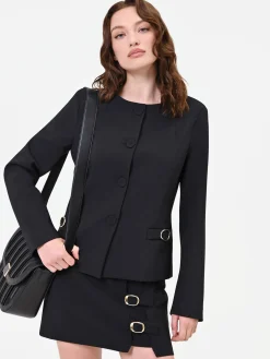 GIACCA NERA CON FIBBIE DECORATIVE
