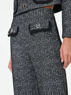PANTALONE NERO IN BOUCLÉ CON TASCHE A TOPPA