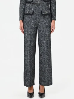 PANTALONE NERO IN BOUCLÉ CON TASCHE A TOPPA