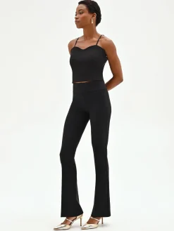 PANTALONE NERO SVASATO IN TESSUTO TECNICO