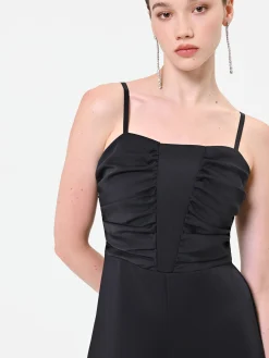 TUTA NERA IN RASO CON CORPETTO DRAPPEGGIATO